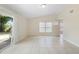 Living room featuring tile flooring, neutral walls and sliding glass door at 5825 Forest Grove Blvd, Orlando, FL 32808