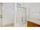 Bathroom featuring a glass shower, door, and vanity with natural light, providing a relaxing space at 6083 Sabal Hammock Cir, Port Orange, FL 32128