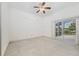 Empty bedroom with sliding glass doors to a lanai at 6083 Sabal Hammock Cir, Port Orange, FL 32128