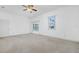 Bedroom with a ceiling fan and sliding glass doors that lead to a pool and outdoor space at 6083 Sabal Hammock Cir, Port Orange, FL 32128