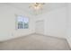 Neutral bedroom with a window overlooking a lanai and a double door closet at 6083 Sabal Hammock Cir, Port Orange, FL 32128