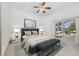 Staged bedroom with neutral tones and sliding doors to the lanai, creating a relaxing retreat at 6083 Sabal Hammock Cir, Port Orange, FL 32128