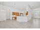 View of open concept kitchen with tile floor, arches, and bright natural light at 6083 Sabal Hammock Cir, Port Orange, FL 32128