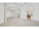 Bright living room featuring decorative columns, high ceilings, tile floor, and arched doorways leading to other rooms at 6083 Sabal Hammock Cir, Port Orange, FL 32128