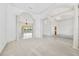 Bright and open living space with elegant columns, neutral tones, and seamless transition to the outdoor area at 6083 Sabal Hammock Cir, Port Orange, FL 32128