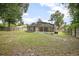 Expansive backyard showcasing a screened pool area, ideal for outdoor enjoyment and privacy at 613 John Thomas Ave, Deland, FL 32724