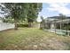 Spacious backyard featuring a screened pool area and privacy fencing at 613 John Thomas Ave, Deland, FL 32724