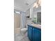 Functional bathroom featuring a shower-tub combination, vanity sink, and built-in storage at 613 John Thomas Ave, Deland, FL 32724