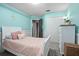 Cheerful bedroom with a bed, closet space, and a decorative wainscotting at 613 John Thomas Ave, Deland, FL 32724