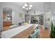 Bright dining room with an inviting table and chairs, complemented by hardwood floors at 613 John Thomas Ave, Deland, FL 32724