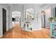 Stylish entryway with hardwood floors, arched doorways, and decorative shelving for a welcoming and organized feel at 613 John Thomas Ave, Deland, FL 32724
