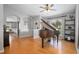 Spacious living room featuring an open floor plan, hardwood floors, and a large window at 613 John Thomas Ave, Deland, FL 32724