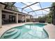Sparkling pool surrounded by a screened enclosure and covered patio area at 613 John Thomas Ave, Deland, FL 32724