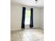 This cozy bedroom features natural light from the window, accented by stylish dark blue curtains at 632 W Hubbard Ave, Deland, FL 32720