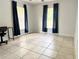 Bedroom with tile floors, closet, lots of natural light, and desk at 632 W Hubbard Ave, Deland, FL 32720