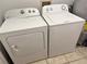 Convenient laundry area with both a Whirlpool dryer and an Amana washing machine at 632 W Hubbard Ave, Deland, FL 32720
