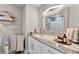 Stylish bathroom featuring modern lighting, granite countertop, and updated fixtures at 64 Ravenwood Ct, Ormond Beach, FL 32174