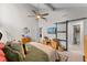Comfortable bedroom features vaulted ceiling, ceiling fan, and access to ensuite bathroom at 64 Ravenwood Ct, Ormond Beach, FL 32174
