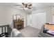 Cozy bedroom features fireplace, double closets, and neutral decor at 64 Ravenwood Ct, Ormond Beach, FL 32174