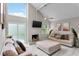Bright living room features high ceilings, modern fireplace, and sliding glass doors to the outdoor area at 64 Ravenwood Ct, Ormond Beach, FL 32174