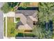 Aerial view of the home showcasing the roof and surrounding greenery at 727 Grape Ivy Ln, New Smyrna Beach, FL 32168