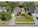 Aerial view of the home with lush landscaping and a spacious yard at 727 Grape Ivy Ln, New Smyrna Beach, FL 32168