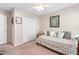 Bright bedroom featuring a daybed, plush pillows, and a closet at 727 Grape Ivy Ln, New Smyrna Beach, FL 32168