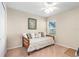 Bright bedroom with a daybed, ceiling fan, and a window at 727 Grape Ivy Ln, New Smyrna Beach, FL 32168