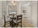 Dining area with natural light from windows looking out onto backyard at 727 Grape Ivy Ln, New Smyrna Beach, FL 32168