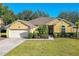 Charming single-story home with a well-manicured lawn and inviting curb appeal at 727 Grape Ivy Ln, New Smyrna Beach, FL 32168