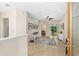 Bright foyer with neutral colors, tile floors, and an open floor plan that leads to the dining and living areas at 727 Grape Ivy Ln, New Smyrna Beach, FL 32168
