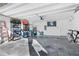 Spacious garage with ample storage and epoxy flooring at 727 Grape Ivy Ln, New Smyrna Beach, FL 32168