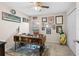 Home office space featuring a ceiling fan, desk, and a window for natural light at 727 Grape Ivy Ln, New Smyrna Beach, FL 32168