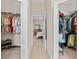 Walk-in closet providing ample storage space and easy access to the main bedroom at 727 Grape Ivy Ln, New Smyrna Beach, FL 32168