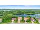 Aerial view of neighborhood homes overlooking a large lake and natural landscape at 762 Onyx Pkwy, Deland, FL 32724