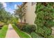 Brick pathway lined with lush landscaping in the backyard at 762 Onyx Pkwy, Deland, FL 32724