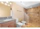 Bathroom featuring granite vanity, toilet, bidet, and large tile and glass block shower at 762 Onyx Pkwy, Deland, FL 32724