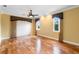 Comfortable bedroom featuring hardwood flooring, a ceiling fan, and natural light at 762 Onyx Pkwy, Deland, FL 32724