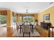 Bright dining room featuring hardwood floors, recessed lighting, and views of the water at 762 Onyx Pkwy, Deland, FL 32724