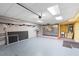 Spacious garage with slat wall, tool storage, utility sink, and tiled floor at 762 Onyx Pkwy, Deland, FL 32724