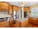 Gourmet kitchen features stainless steel appliances, granite countertops, and kitchen island at 762 Onyx Pkwy, Deland, FL 32724