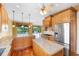 Spacious kitchen with granite countertops, stainless steel appliances, hardwood floors, and water view at 762 Onyx Pkwy, Deland, FL 32724