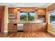 Kitchenette with granite countertops, stainless steel appliances, wood cabinetry, and a view to the outdoors at 762 Onyx Pkwy, Deland, FL 32724