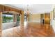 Open living room offering hardwood floors, recessed lighting, and slider access to outdoor balcony at 762 Onyx Pkwy, Deland, FL 32724