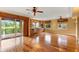 Large living area with hardwood floors, recessed lighting, and a sliding glass door to an outdoor terrace at 762 Onyx Pkwy, Deland, FL 32724