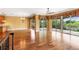 Large living room featuring hardwood floors and sliding glass doors to a large balcony overlooking water at 762 Onyx Pkwy, Deland, FL 32724