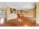 Open-concept living room flows into kitchen, featuring hardwood floors and water view at 762 Onyx Pkwy, Deland, FL 32724