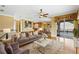 Stylishly furnished living room adjacent to kitchen with large windows and seating area at 762 Onyx Pkwy, Deland, FL 32724