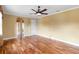 Spacious living room with wood floors, neutral walls, and recessed lights at 762 Onyx Pkwy, Deland, FL 32724