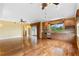 Open living space with hardwood floors, recessed lighting and an open kitchen area with bar seating at 762 Onyx Pkwy, Deland, FL 32724